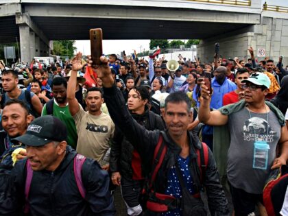 Migrants from Central and South America take part in a caravan towards the border with the