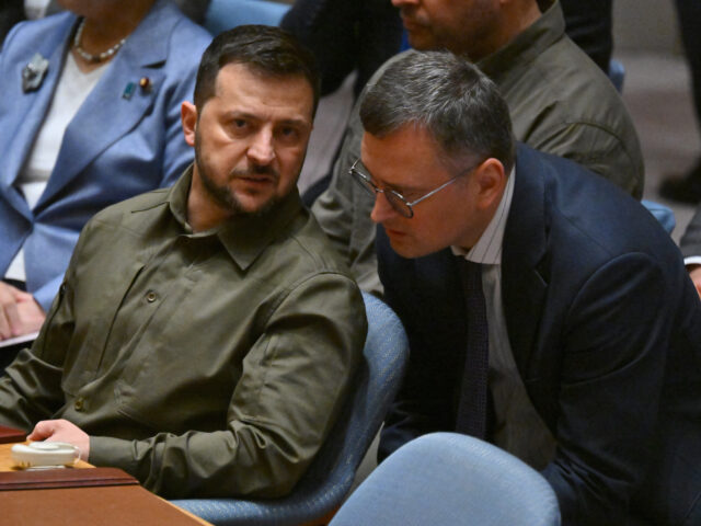 Ukrainian President Volodymyr Zelenskyy speaks with his Foreign Minister Dmytro Kuleba dur