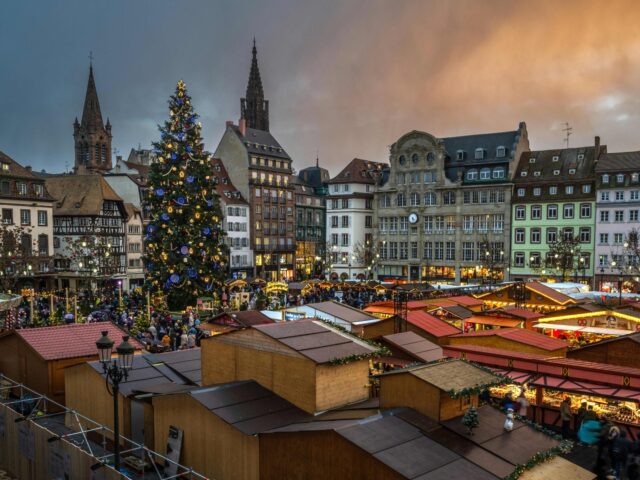 A general view shows a giant Christmas tree (L), as people gather on the opening day of th