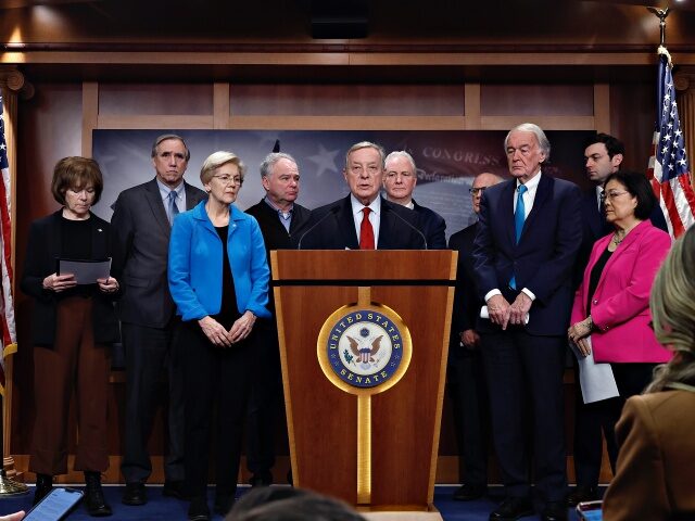 WASHINGTON, DC - FEBRUARY 09: Senate Minority Whip Richard Durbin (D-IL) (C) talks to repo
