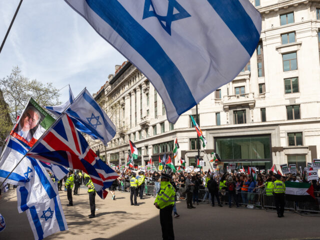 Members of the Jewish community attend a small counter-protest to the March for Palestine