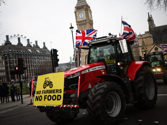 TOPSHOT - Farmers drive their tractor in front of the Elizabeth Tower, commonly known by t