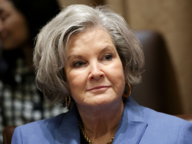 WASHINGTON, DC - MARCH 25: Chief of Staff Susie Wiles listens as U.S. President Donald Tru