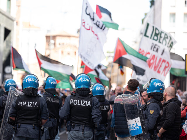MILAN, ITALY - APRIL 25: Police monitor pro-Palestinian protesters during a commemoration