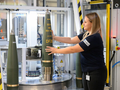 27 August 2025, Lower Saxony, Unterlüß: Employees produce 155mm artillery ammunition at
