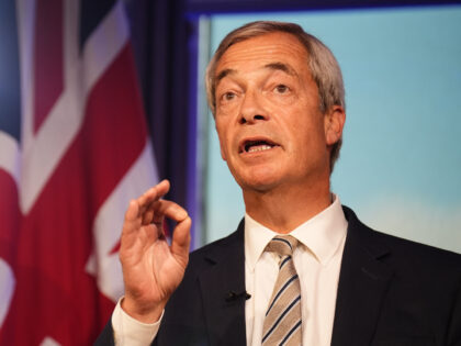 Reform UK leader Nigel Farage reacts to the speech by Prime Minister Sir Keir Starmer at t
