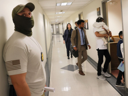 NEW YORK, NEW YORK - OCTOBER 16: A man enters his court hearing in immigration court as fe