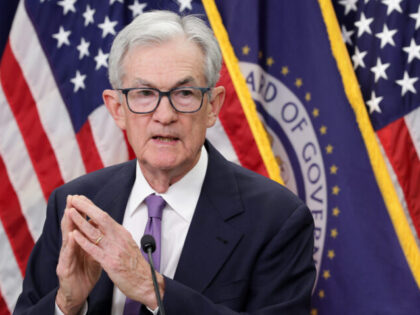 Deeply Divided Fed Lowers Rates by Quarter-Point