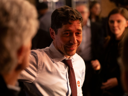 MINNEAPOLIS, MINNESOTA - NOVEMBER 4: Minneapolis Mayor Jacob Frey (C) greets supporters at