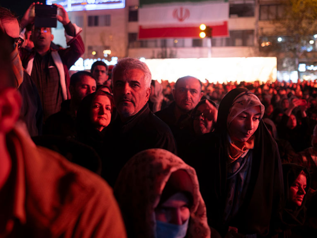 Iranian people attend a state event unveiling a sculpture of the Roman emperor Valerian an