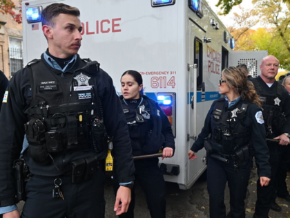CHICAGO, ILLINOIS - NOVEMBER 8: Police officers take security measures with batons as U.S.
