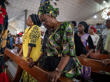 Catholics pray at the Saint Michael's Cathedral during the Sunday's service in Minna on No