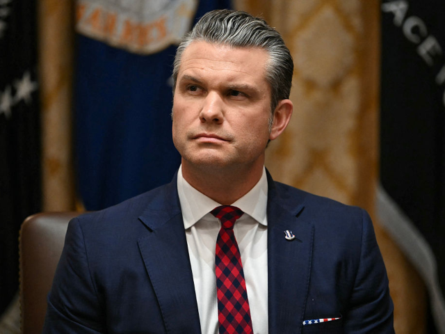 GettyImages-2248985498_ US Secretary of Defense Pete Hegseth listens as President Donald Trump speaks during a Cab