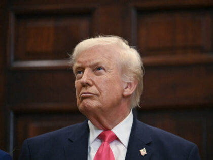US President Donald Trump looks on during an announcement of a $6.25 billion donation from