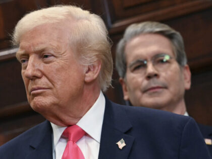 (L-R) US President Donald Trump and US Secretary of Treasury Scott Bassent, look on during