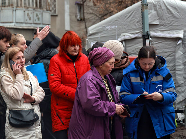 Aftermath of Russian strike on Odesa on December 4, 2025 Residents of an apartment building damaged by a Russian attack are seen with a representat
