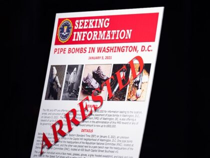 UNITED STATES - DECEMBER 4: A poster is seen at the Department of Justice during a news co