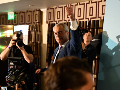 Reform UK leader, Nigel Farage reacts after speaking on stage at a rally in Falkirk, Scotl