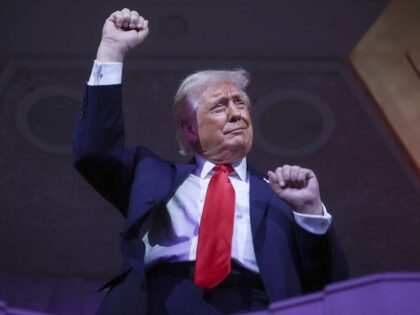 U.S. President Donald Trump dances to the final performance of the Village People during t
