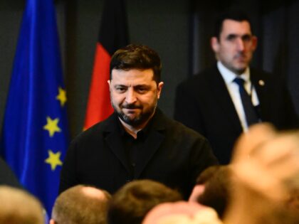 Ukraine's President Volodymyr Zelensky leaves after delivering a speech during the 8th Ger