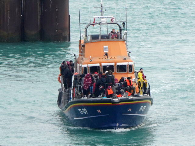 A group of people thought to be migrants are brought in to the Border Force compound in Do