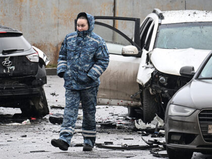 An investigator works at the car blast site in southern Moscow on December 22, 2025. Lieut
