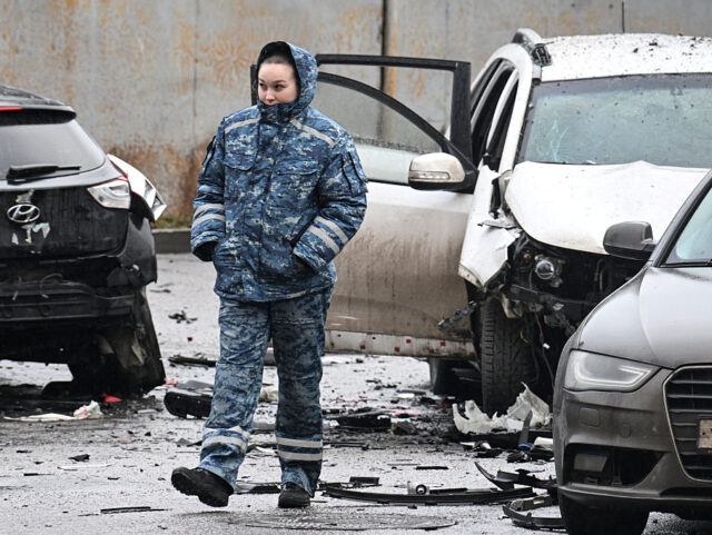 An investigator works at the car blast site in southern Moscow on December 22, 2025. Lieut