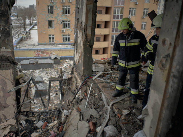 KYIV, UKRAINE - DECEMBER 27: Ukrainian emergency services dismantle debris on the fifth fl