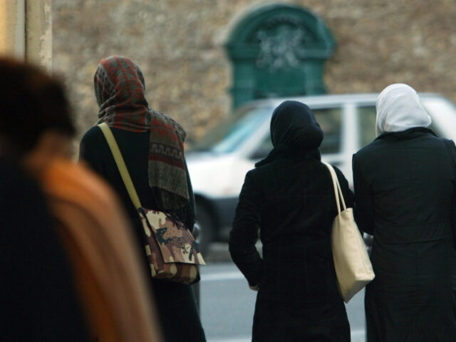 PARIS - DECEMBER 17: Unidentified muslim pupils walk to a Mosque December 17, 2003 in Pari