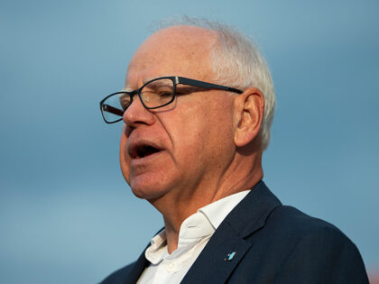Minnesota Gov. Tim Walz speaks to media gathered on the first day of school at Deerwood El
