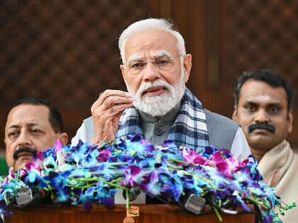 India's Prime Minister Narendra Modi (C) addresses the media on the first day of the Parli