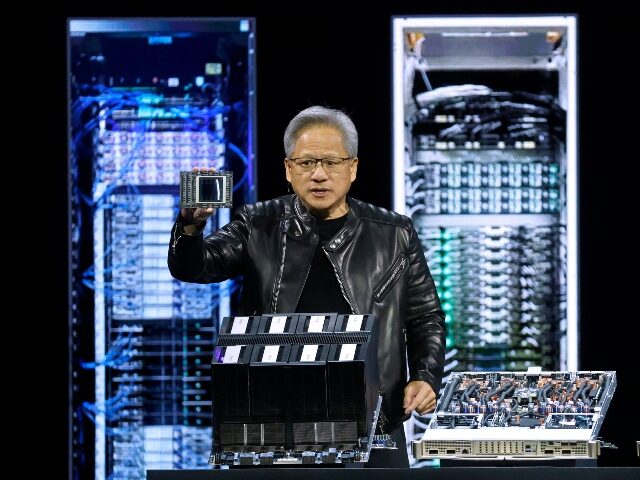 Jensen Huang of Nvidia holding chips bound for China