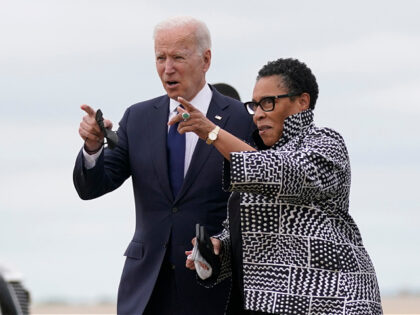 President Joe Biden walks with Housing and Urban Development Secretary Marcia Fudge as he