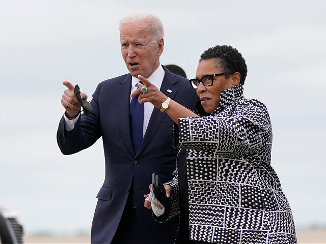 President Joe Biden walks with Housing and Urban Development Secretary Marcia Fudge as he