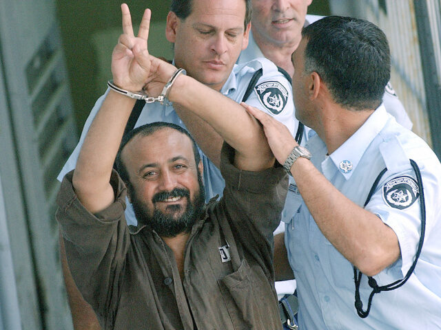 Hand cuffed and flashing the 'V'-sign, Marwan Barghuti the leader of Yasser Araf