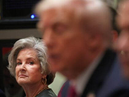 White House Chief of Staff Susie Wiles (L) looks on as US President Donald Trump (C) meets
