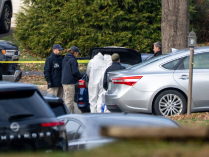 Prince William County police seal the street in front of the home of suspected January 6th