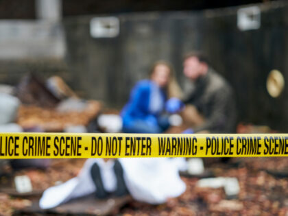 Police Crime Scene LEREXIS. A tape for a crime scene in a building with a blurred background of a forensi