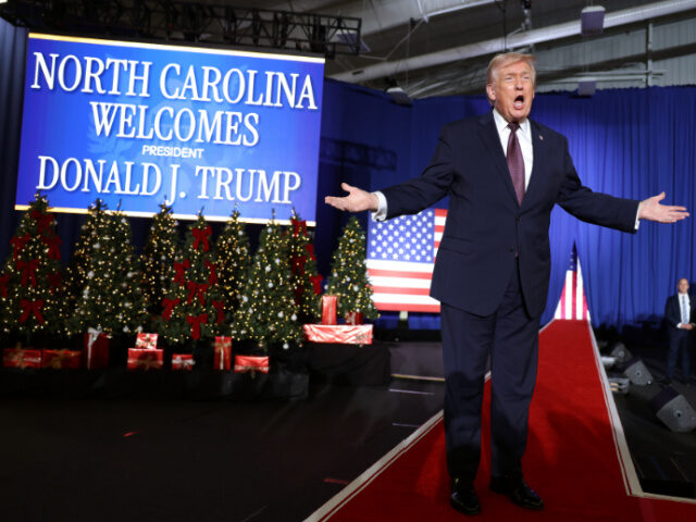 U.S. President Donald Trump takes the stage during a rally at the Rocky Mount Event Center