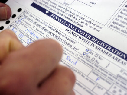 Reid McHenry, a student from Maine, registers to vote in the Presidential election on the