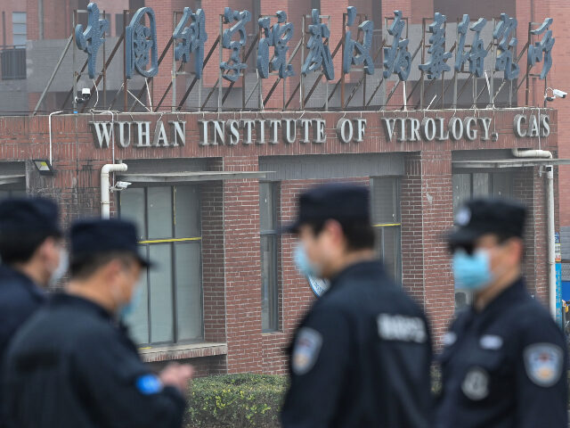 Wuhan Institute of Virology Security personnel stand guard outside the Wuhan Institute of Virology in Wuhan as members