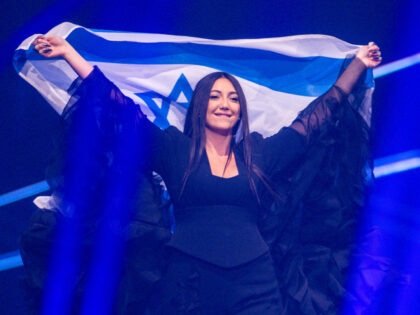 6 May 2025, Switzerland, Basel: Yuval Raphael from Israel runs onto the stage with the fla