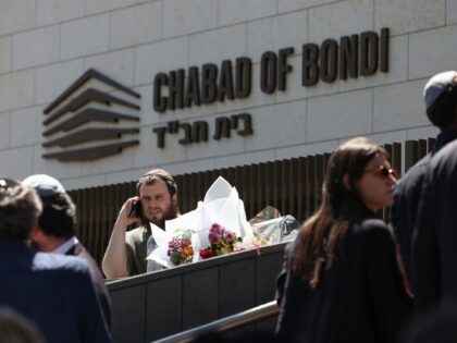 Mourners attend the funeral of rabbi Eli Schlanger, who was killed in the December 14 Bond