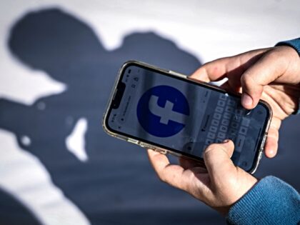 This photo taken on October 24, 2025 shows a 14-year-old boy posing at his home near Gosfo
