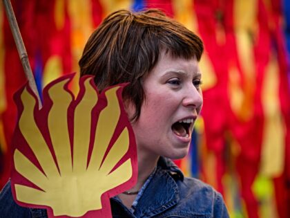 NGLAND - OCTOBER 23: An environmental protestor joins a demonstration by Fossil Free Londo
