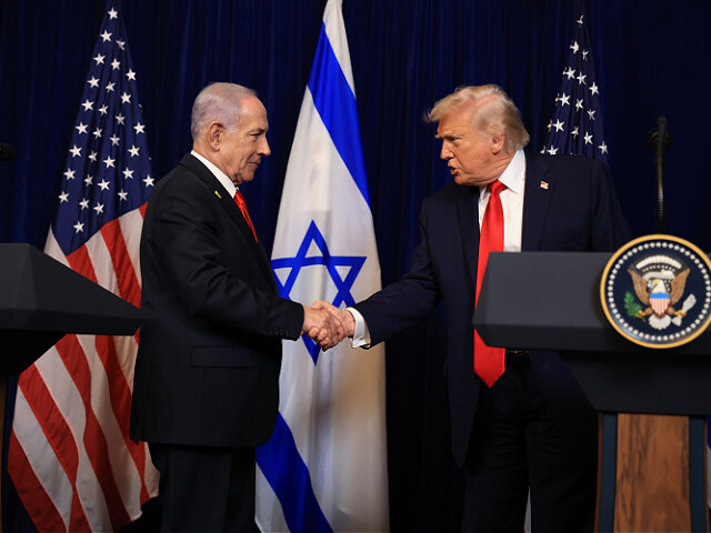 PALM BEACH, FLORIDA - DECEMBER 29: U.S. President Donald Trump shakes hands with Israeli P