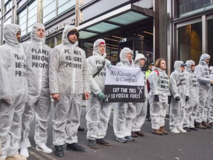 LONDON, UNITED KINGDOM - 2025/02/17: Protesters wearing hazmat suits emblazoned with the s