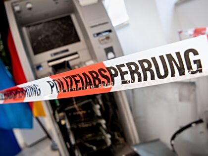 15 December 2020, Bavaria, Munich: A blown-up ATM is displayed behind a flutter tape with