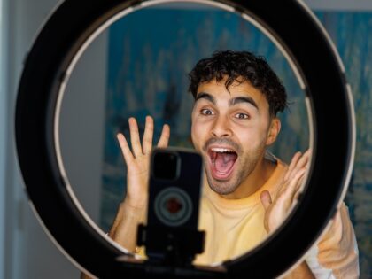 goofy guy filming a TikTok video