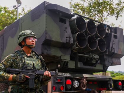 AICHUNG, TAIWAN - JULY 12: Soldiers of the 58th Artillery Command stand guard next to the